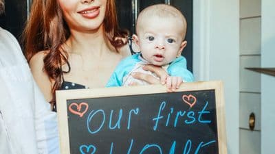 Young family celebrating first home purchase with baby